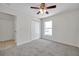 Neutral bedroom with carpet, ceiling fan, and closet at 7459 Oxford Garden Cir, Apollo Beach, FL 33572