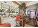 Home bar featuring decorative chairs, mirrored backsplash, and plenty of storage at 7623 Radcliffe Cir # 112A, Port Richey, FL 34668