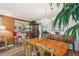 Dining room with a chandelier, bar area, and plenty of natural light at 7623 Radcliffe Cir # 112A, Port Richey, FL 34668