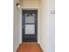 Condo entryway featuring a black apartment door and visible unit number at 7623 Radcliffe Cir # 112A, Port Richey, FL 34668