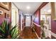 Hallway with hardwood floors, decor, and a view to the kitchen at 7623 Radcliffe Cir # 112A, Port Richey, FL 34668