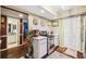 Open kitchenette with stainless steel appliances and access to the bathroom at 7623 Radcliffe Cir # 112A, Port Richey, FL 34668