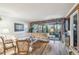 Bright living room with a large sofa, coffee table, and view of the outdoors at 7623 Radcliffe Cir # 112A, Port Richey, FL 34668