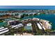 Enjoy great views of this community from the air, including the tennis courts, parking, and complex pool at 7700 Sun Island S Dr # 608, South Pasadena, FL 33707