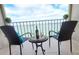 Breathtaking water view on this spacious balcony, featuring comfortable seating and serene outdoor space at 7700 Sun Island S Dr # 608, South Pasadena, FL 33707