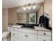 Bathroom featuring white cabinets and light fixtures, a modern sink and countertop, next to the toilet at 7700 Sun Island S Dr # 608, South Pasadena, FL 33707