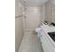 Bathroom featuring a tiled shower, toilet, and vanity with white cabinets at 7700 Sun Island S Dr # 608, South Pasadena, FL 33707