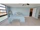 A peaceful bedroom with water views, soft blue walls, and a plush bed for ultimate comfort at 7700 Sun Island S Dr # 608, South Pasadena, FL 33707