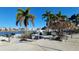 Community space with grill, tiki tables, and seating with bay views at 7700 Sun Island S Dr # 608, South Pasadena, FL 33707