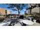 Relaxing community space with seating under trees with bay views at 7700 Sun Island S Dr # 608, South Pasadena, FL 33707