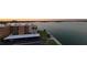 A building with a parking area and a view of the water and the city at 7700 Sun Island S Dr # 608, South Pasadena, FL 33707