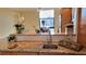 Lovely kitchen with granite counters, wooden cabinets, and stainless steel sink at 7700 Sun Island S Dr # 608, South Pasadena, FL 33707