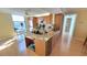 Charming kitchen with granite counters, wooden cabinets, and adjacent breakfast nook at 7700 Sun Island S Dr # 608, South Pasadena, FL 33707
