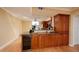 Spacious kitchen featuring granite countertops, ample cabinet space, and a wine refrigerator at 7700 Sun Island S Dr # 608, South Pasadena, FL 33707