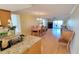Open-concept living room with dining area and natural light, perfect for entertaining at 7700 Sun Island S Dr # 608, South Pasadena, FL 33707