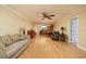 Spacious living room with wood floors that flows into the kitchen and dining areas at 7700 Sun Island S Dr # 608, South Pasadena, FL 33707
