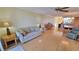 Open-concept living space with wood floors throughout the living room, dining area, and kitchen at 7700 Sun Island S Dr # 608, South Pasadena, FL 33707
