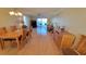Bright and airy living and dining space with wood floors and access to a private balcony at 7700 Sun Island S Dr # 608, South Pasadena, FL 33707