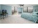 Sun-filled main bedroom boasts expansive windows with stunning water views and plush carpeting at 7700 Sun Island S Dr # 608, South Pasadena, FL 33707