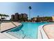 Large community pool with clear water, brick surround, and ample seating at 7700 Sun Island S Dr # 608, South Pasadena, FL 33707