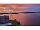 Sunset view overlooking a tranquil bay, showcasing the beautiful waterfront location at 7700 Sun Island S Dr # 608, South Pasadena, FL 33707