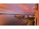 Scenic sunset view overlooking waterfront condos and a peaceful bay area reflecting the colorful sky at 7700 Sun Island S Dr # 608, South Pasadena, FL 33707
