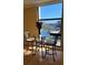 This water view features a building, tennis court, and sunny skies at 7700 Sun Island S Dr # 608, South Pasadena, FL 33707