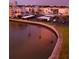 Waterfront community featuring covered parking, lush landscaping, and waterfront views at 7700 Sun Island S Dr # 608, South Pasadena, FL 33707