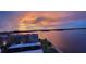 Sunset view overlooking the waterfront condo community and a serene bay area at 7700 Sun Island S Dr # 608, South Pasadena, FL 33707