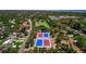 Aerial view of the property highlighting its proximity to neighborhood tennis courts and recreational areas at 834 Riverside Dr, Tarpon Springs, FL 34689