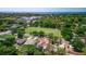 Aerial view featuring a sports field, school, and the property, illustrating its location within the community at 834 Riverside Dr, Tarpon Springs, FL 34689