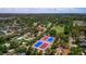 Bird's-eye view showcasing the property's convenient location near tennis courts and a green playing field at 834 Riverside Dr, Tarpon Springs, FL 34689