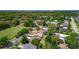 Wide aerial shot capturing the community and the property's proximity to green spaces and local amenities at 834 Riverside Dr, Tarpon Springs, FL 34689