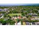 Community aerial shot exhibiting proximity to a sports field, a school, and surrounding residential areas at 834 Riverside Dr, Tarpon Springs, FL 34689