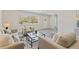Airy living room highlighting neutral decor, recessed lights, and stylish contemporary design at 834 Riverside Dr, Tarpon Springs, FL 34689