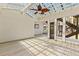 This sunroom features a wood plank floor, clear lattice ceiling, and an outdoor view at 834 Riverside Dr, Tarpon Springs, FL 34689