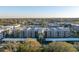 Wide aerial view of the condo community, with lush landscaping and well-maintained buildings at 8681 Bardmoor Blvd # 208C, Seminole, FL 33777
