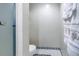 Compact bathroom featuring modern fixtures, including a toilet, towel rack, and tiled flooring at 8681 Bardmoor Blvd # 208C, Seminole, FL 33777
