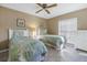 Inviting bedroom showcasing two twin beds with coordinating bedding and a bright window at 8681 Bardmoor Blvd # 208C, Seminole, FL 33777