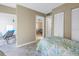 Bright bedroom with tile floor, an outdoor patio and a glimpse into the living room at 8681 Bardmoor Blvd # 208C, Seminole, FL 33777