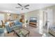 Bright and spacious living area featuring tile floors, comfortable seating, and a dining area at 8681 Bardmoor Blvd # 208C, Seminole, FL 33777