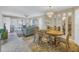 Open-concept living and dining area with tile floors, neutral tones, and ample natural light at 8681 Bardmoor Blvd # 208C, Seminole, FL 33777