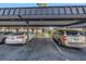 Covered parking area showcasing assigned spaces and a well-kept exterior of the condo building at 8681 Bardmoor Blvd # 208C, Seminole, FL 33777