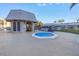 Exterior view of the pool area with a small octagonal spa and covered shelter at 8681 Bardmoor Blvd # 208C, Seminole, FL 33777