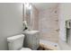 Modern bathroom with a step-in shower, vanity and tiled walls at 924 N Castle Ct, Tampa, FL 33612