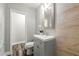 Modern bathroom with a step-in shower, vanity and tiled walls at 924 N Castle Ct, Tampa, FL 33612