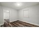 Bright bedroom featuring hardwood floors and natural light at 924 N Castle Ct, Tampa, FL 33612