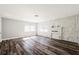 Bright living room with wood floors, white brick fireplace, and large windows providing natural light at 924 N Castle Ct, Tampa, FL 33612
