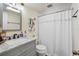 Bathroom featuring a stylish vanity with marble counter, a modern sink, and a shower-tub combination at 929 S Oregon Ave, Tampa, FL 33606