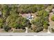 An aerial view of a charming home nestled among mature trees and lush greenery at 9377 Preston Rd, Brooksville, FL 34601